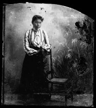 Girl with striped shirt and chair