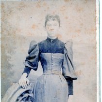 Woman in a Vest Style Dress