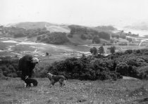 Nellie Armager with cocker spaniels at site of Enchanted Knolls, 1945
