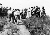 Women hiking in dresses, date unknown