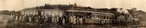 Panorama of passengers in front of a train, 1920