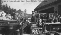 Fireman at Wheel of FireTtruck, 1940s.