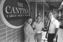 Fire Chief Bob Sousa accepting check from Rick Enos, date unknown.