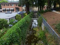 Creekbed and path leading to shops, 2016
