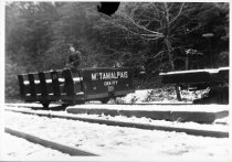 Bill Feeney Sr. on gravity car at Lee Street siding, 1922.