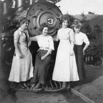Women posing with the Mt. Tamalpais and Muir Woods Railway engine no. 3, 19