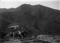 Crew tearing up railroad track, 1930