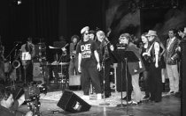 Syd Straw with a group of musicians at a Tribute to Hal Willner, 1990