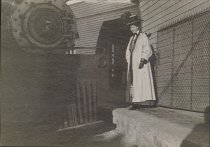 Female passenger and engine, circa 1902