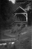 A black and white photo showing the "The Old Mill", 1920s