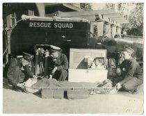 Mill Valley Firemen of the Rescue Squad with fire victim, circa 1919