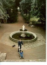 Peter Coyote and child in stroller, winter 1986