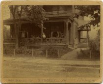 James Jenkins sitting on porch railing, circa 1894