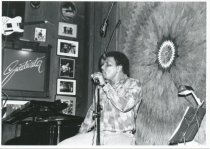 Sitting, on stage at Sweetwater