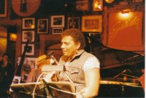 8 photos on stage at Sweetwater. One photo (image a) also shows Rob Wasserm