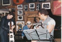 8 photos on stage at Sweetwater. One photo (image a) also shows Rob Wasserm