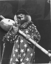 Photo of Wavy Gravy in clown costume, with an aritcle about Wavy Gravy from