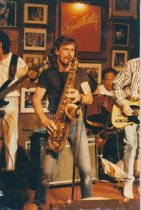 3 photos, Concert Hall West, 1987. 1 of Lorin Rowen of the Edge, and 2 of