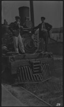 Colin Devine and L. Coyne on locomotive, 1918