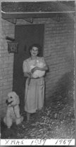 Woman with cat and dog, c. 1957