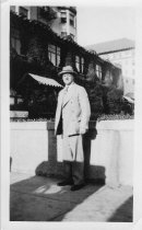 Unknown man standing outside unknown building 1926