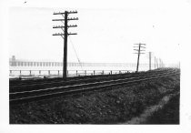 Railroad commuter train line, telephone poles, Richardson Bay Bridge, circa