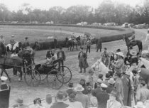 Horse show or horse race in outdoor arena, unknown