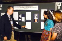 Conference attendees looking at an exhibit, 1998