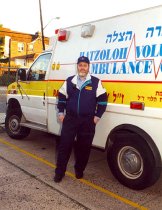 Israel Bochner beside ambulance