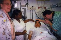 Israel Bochner examining patient's eye