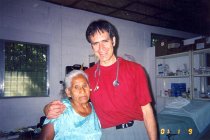 Peter Chapa with patient, 2001
