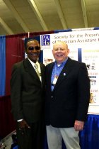 Reginald Carter and Prentiss Harrison in front of PAHx booth