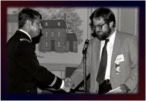 CWO Phil Clarkson shakes Ken Harbert's hand