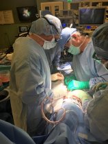 Steve Wilson (left) performs surgery with Dr. Nick Ogburn