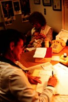 AAPA Promotional Photos - PA Taking Exam Notes with Woman and Child, undated