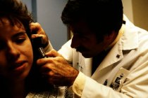 AAPA Promotional Photos - Man Examines Woman's Ear, undated