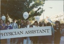 Unidentified woman holds sign during March on Trenton, 1989