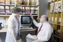 Victor Germino with Computer and Assistant, 1987