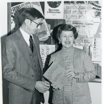 James M. O'Brien accepts book from local author