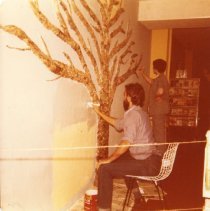 Tom Palik and Rita Ann Bert paint the wall blue