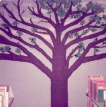 Paper-mache tree with brown bark and green leaves