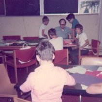 Robert Kopek assists children with their crafts