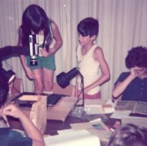 Children take turns using machine