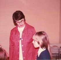 Rita Ann Bert speaks with young girl