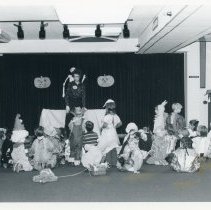 Children wait for Halloween program to begin