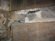 Deflection and fracture above summer beam in cellar
