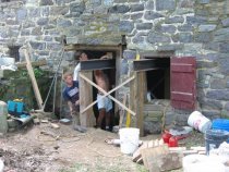 Setting I-beam shoring during restoration of DeTurk east eaves wall (2009)