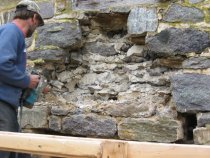#7 - 1626:Removing wall course above stones bedded on doorway lintel
