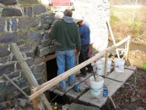 #1-1620:Scaffolding set for masonry repair above kitchen doorway