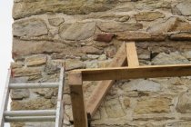 #2, 4697: Detail of pent roof hip framing under "flashing" stone